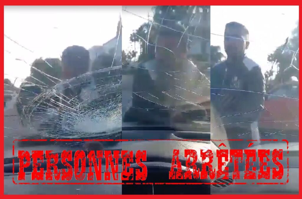 لحظة اعتلاء شخص للواقي الزجاجي لسيارة بالشارع العام